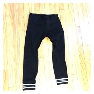 Black workout leggings with white stripes